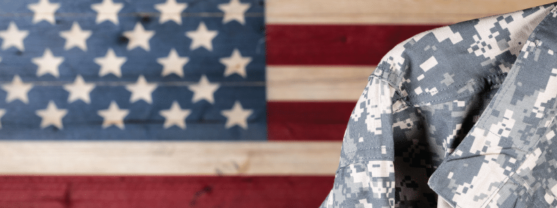 Image of soldier in front of US flag