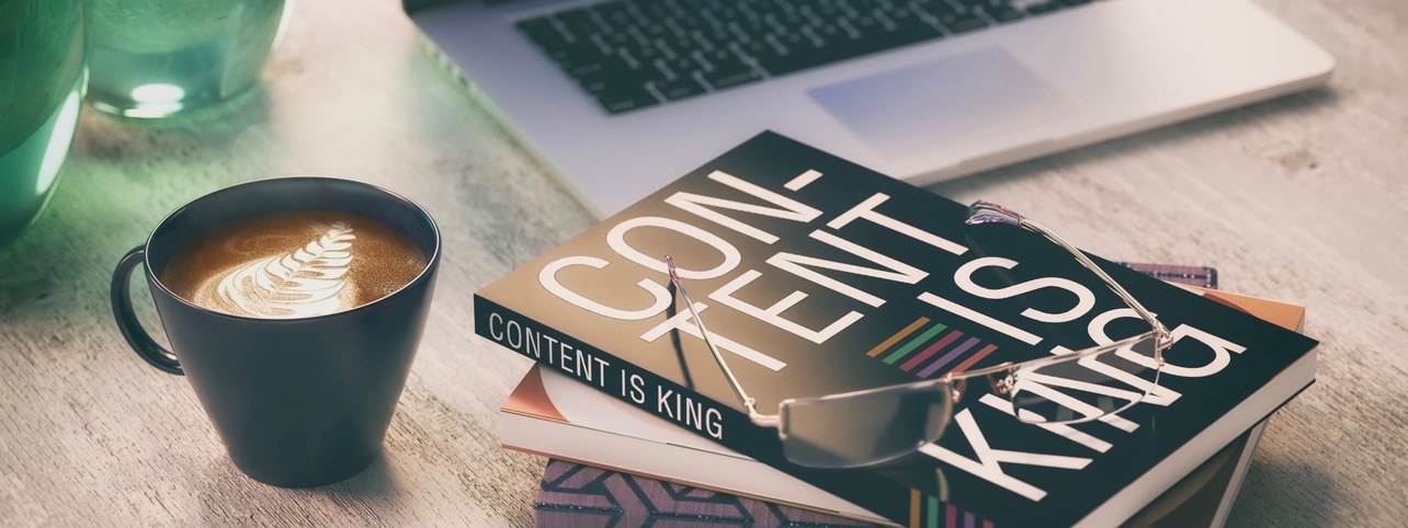 content is king, coffee and books with computer