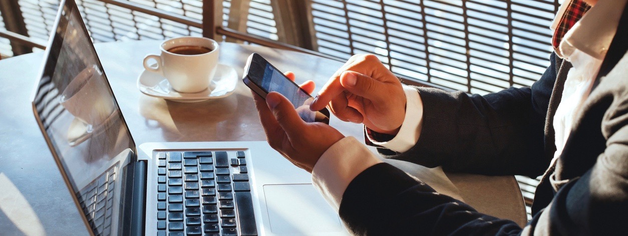 businessman sending text on smartphone