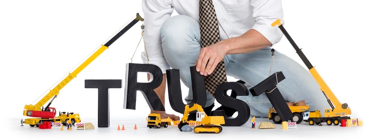 Build up trust: Businessman building trust-word.