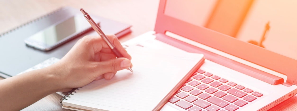 Close Up of woman hands using mobile phone and laptop