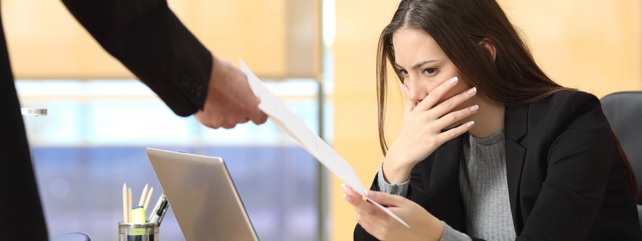 Businesswoman receiving a subpar report from a colleague