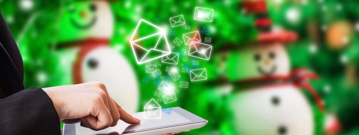 Businesswoman sending email during the holidays