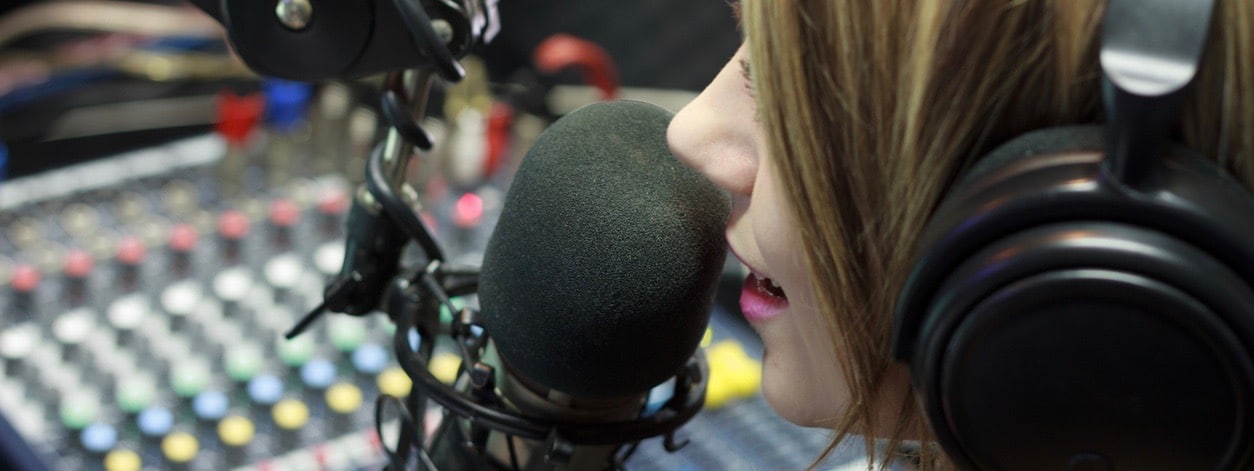 Woman Working As Host Live In Podcast Studio