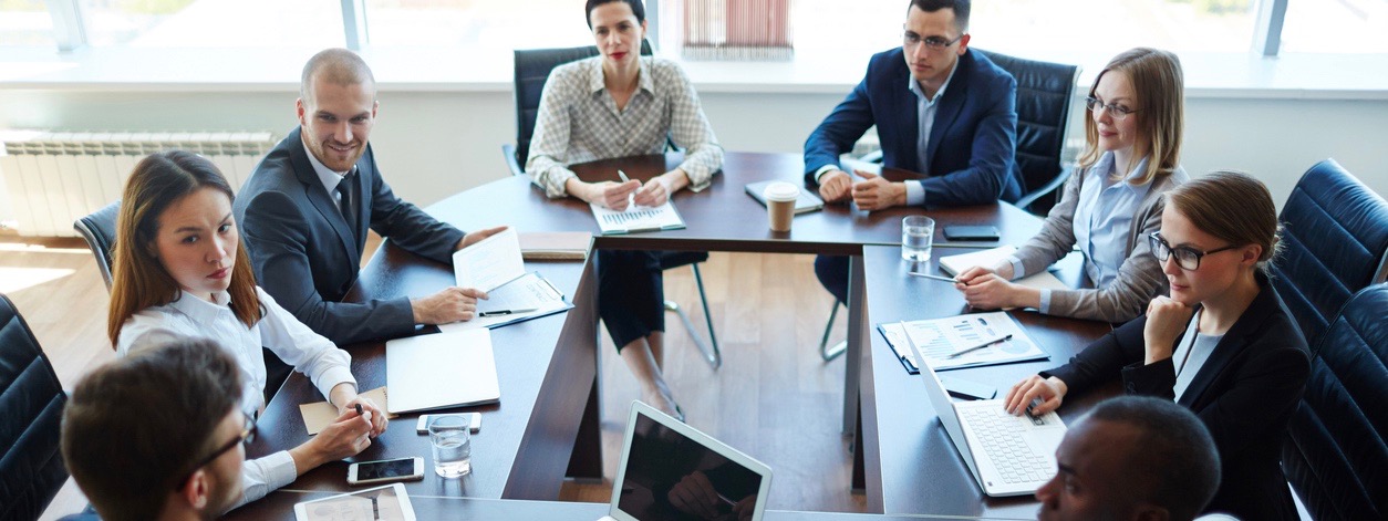 Businespeople at panel discussion in board room