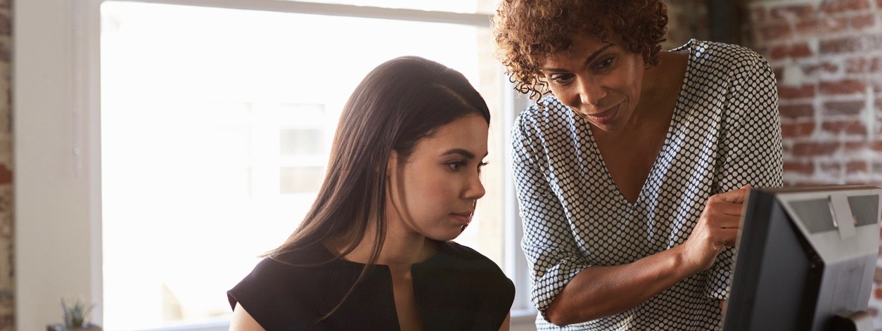 Businesswoman mentoring a younger staffer