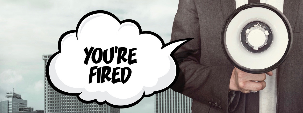 Youre fired text on speech bubble with businessman and megaphone on city background