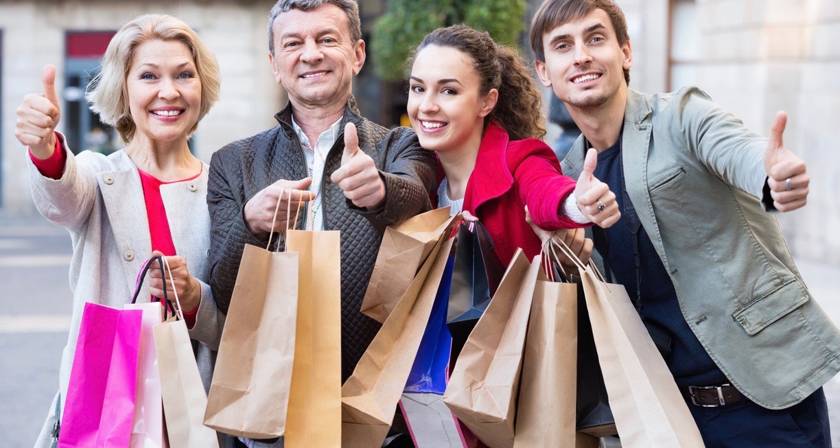 Close up of smiling shoppers with purchases