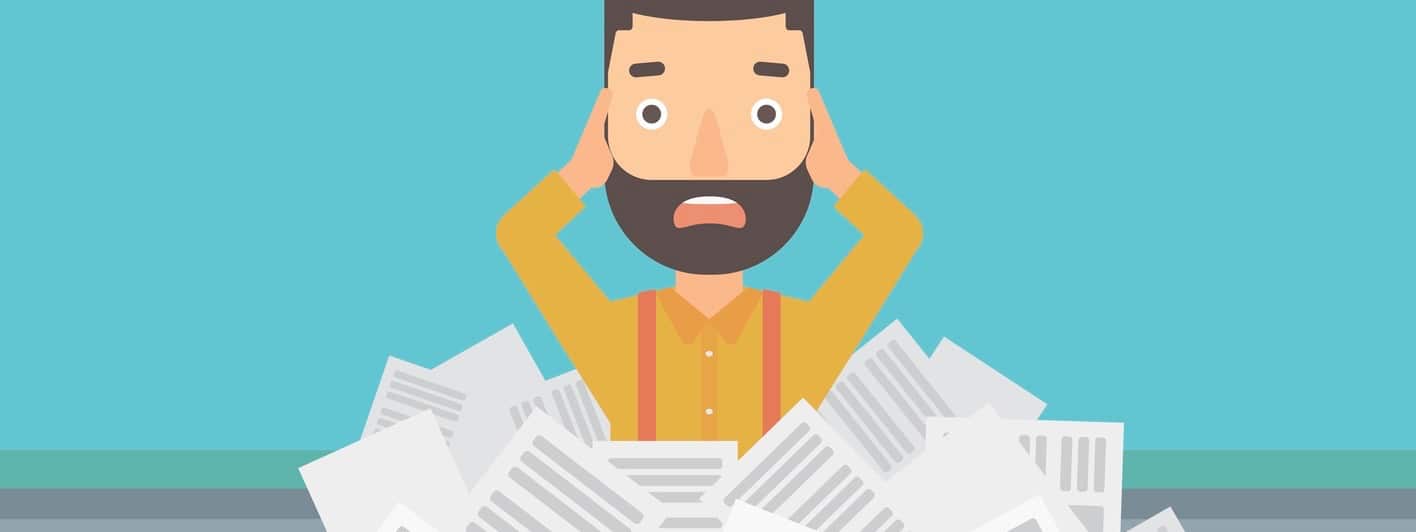 Stressed employer with mounds of paperwork and recall notices