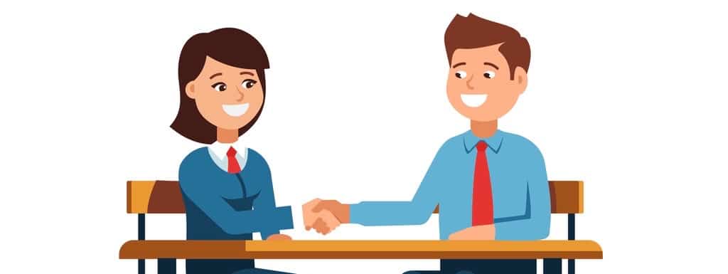 The meeting of two businessmen and businesswoman business handshake. A young man and woman in a business suit holds out his hand in greeting to the partner sitting at the office desk .