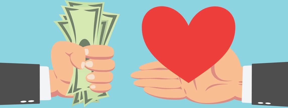 Hand of businessman with money buying Heart isolated on blue background