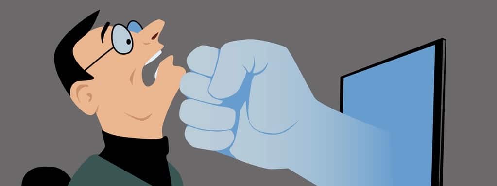 Giant fist coming out of a computer screen and striking a man as a metaphor for negative comment, EPS 8 vector illustration
