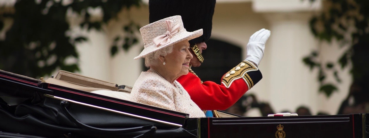 Queen Elizabeth II in an open carriage with Prince Philip