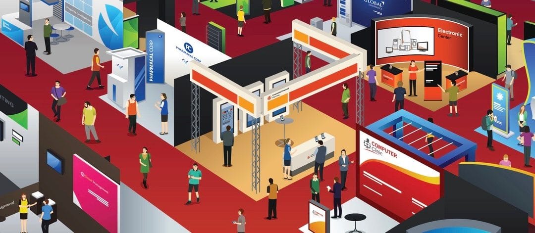 people looking at an exhibition booths