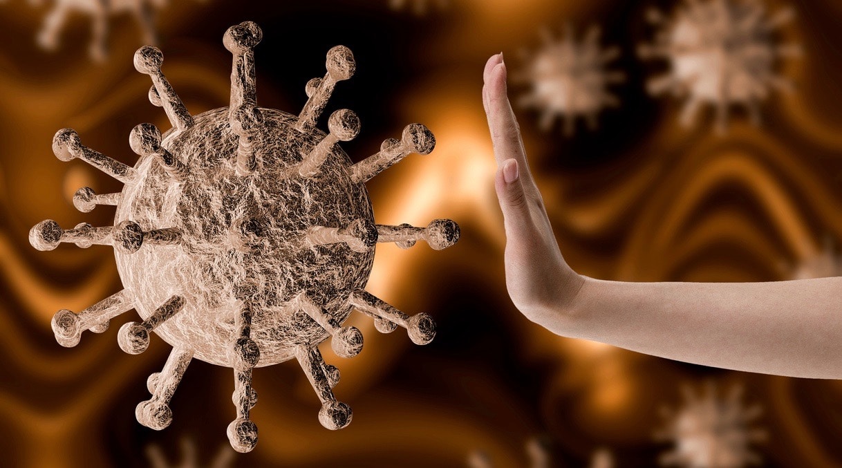 woman with her hand resisting and preventing coronavirus