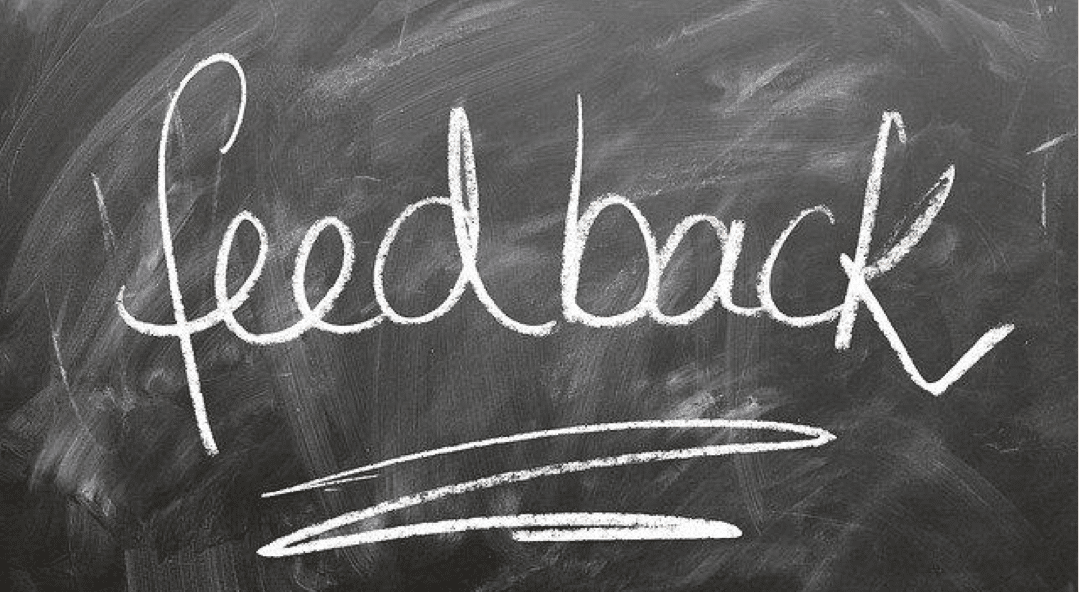 A blackboard showing feedback written in chalk.