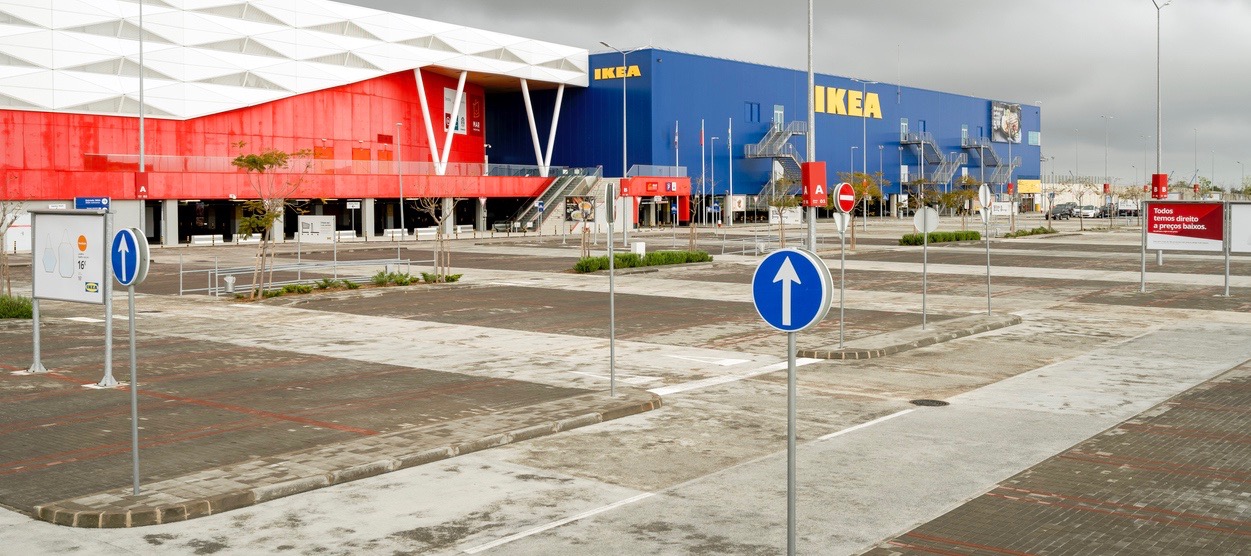 Empty parking lot in front of the biggest shopping mall in Algarve - MAR Shopping Mall, Designer Outlet and Ikea - due to emergency state caused by coronavirus pandemic