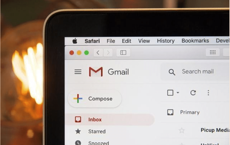 A laptop with a Gmail interface.