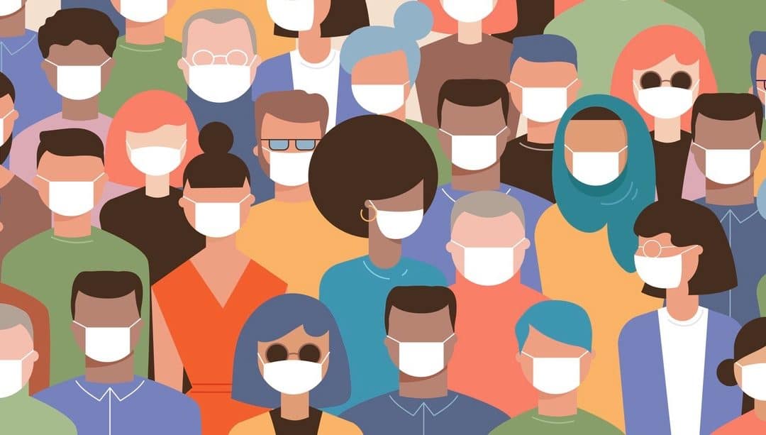 Crowd on the street wearing masks to prevent coronavirus.
