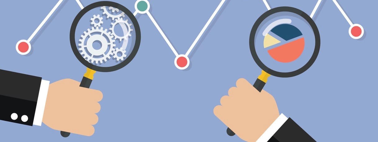 Hands holding magnifying glass for data analysis.