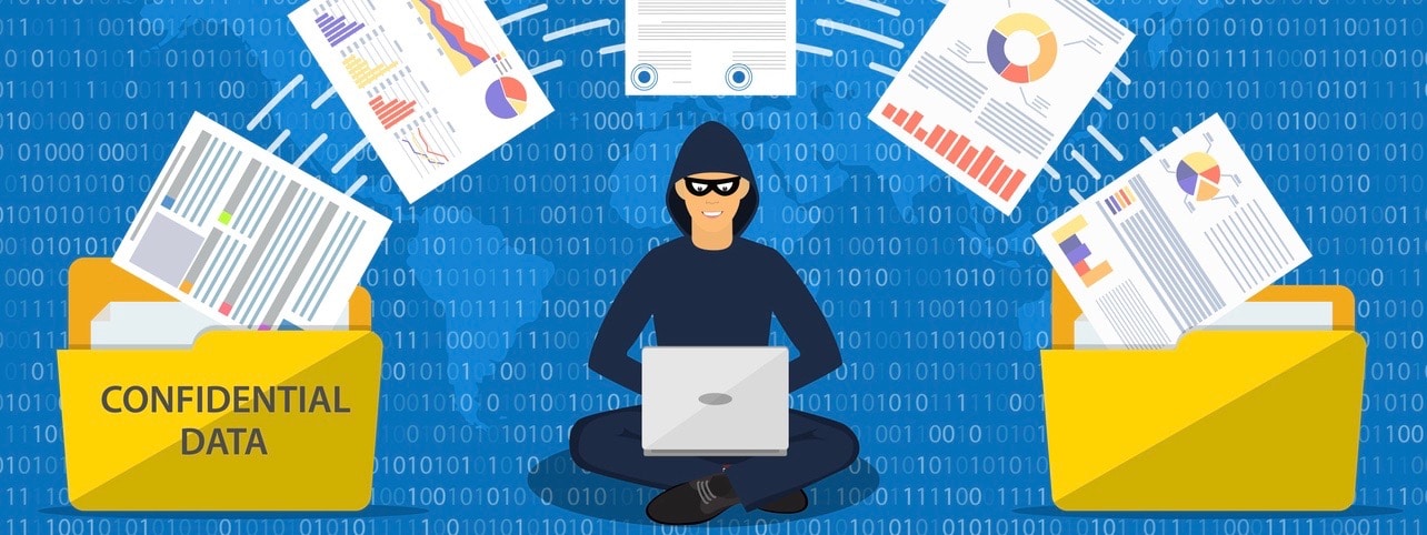 Data phishing, hacker attack.Thief hacker in mask stealing personal information from laptop.