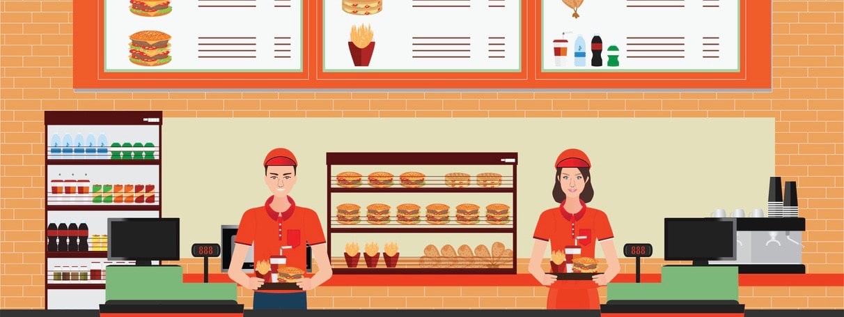 Male and female cashier at fast food restaurant interior with hamburger and beverage.