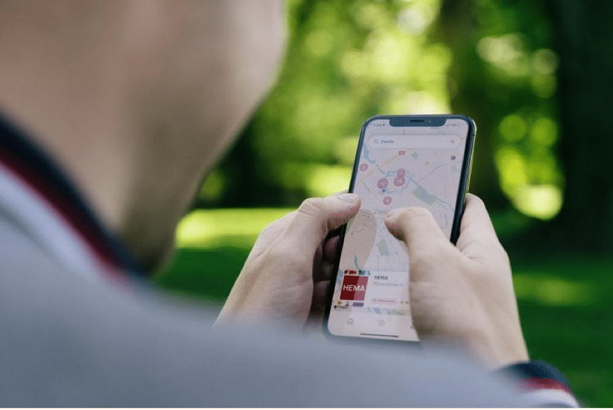 Person looking up a business on a map app.