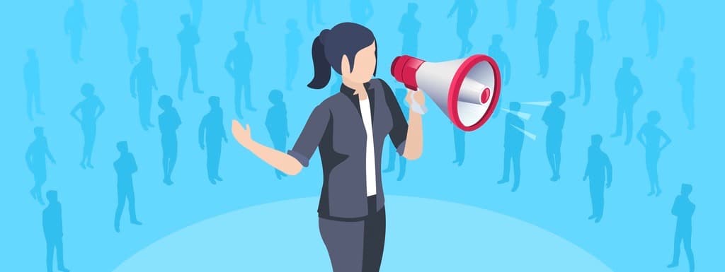 woman in a business suit with a loudspeaker, speaker at a speech in front of listeners