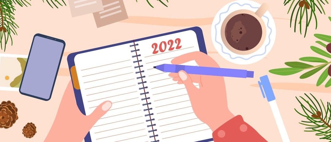 New Year goals and resolutions concept. Woman writes down her dreams and plans for future in notebook.