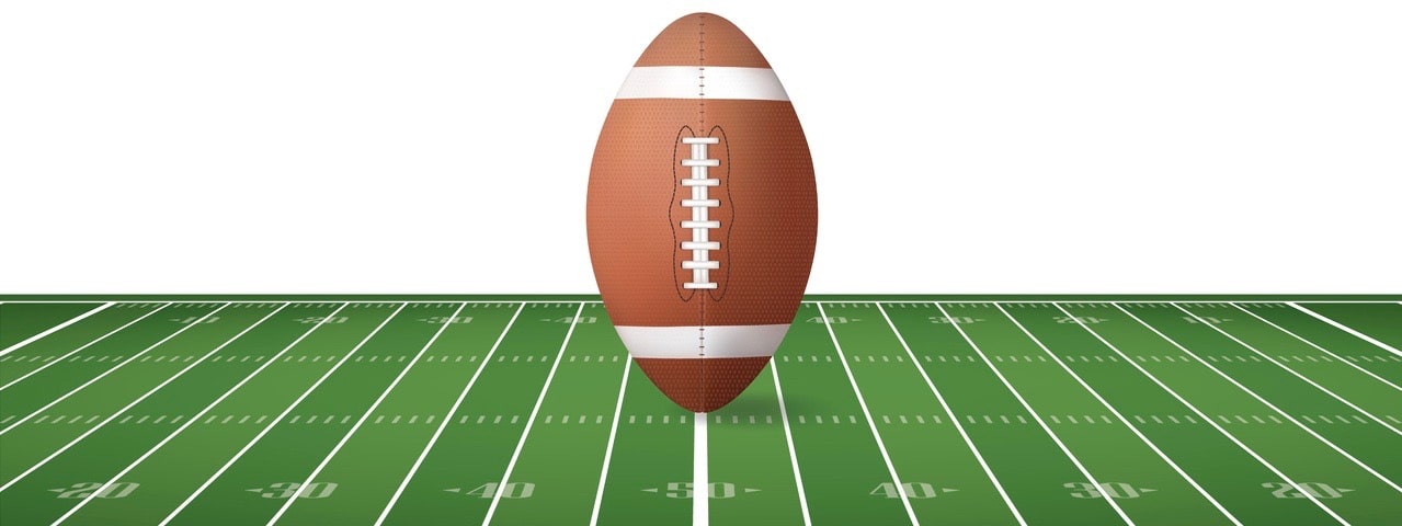 Football ball on football field with line pattern area for background.