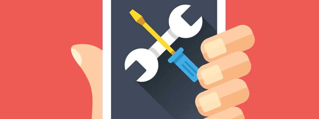 Wrench and screwdriver icon on smartphone screen.