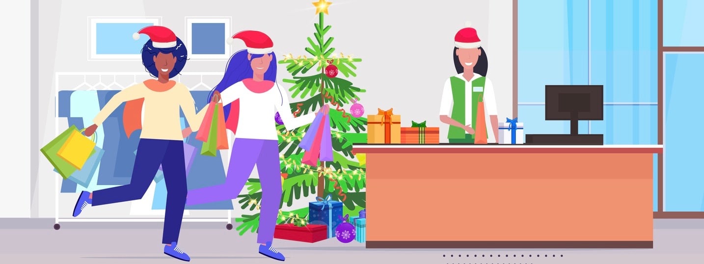 girls in santa hats with shopping bags standing at cash desk with female cashier christmas sale