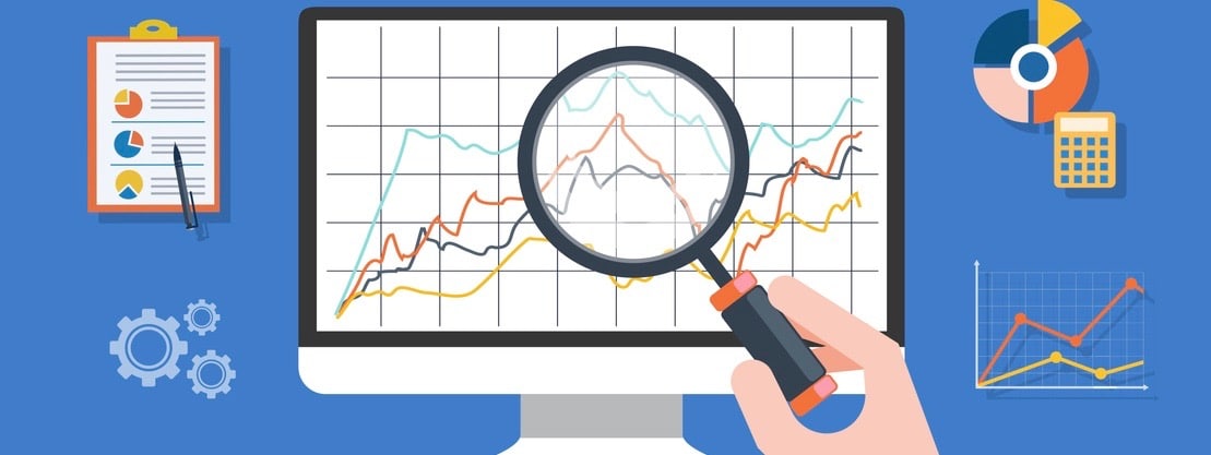 Magnifying glass on gear and multicolored pie chart. Hand holding a magnifying glass at the monitor.