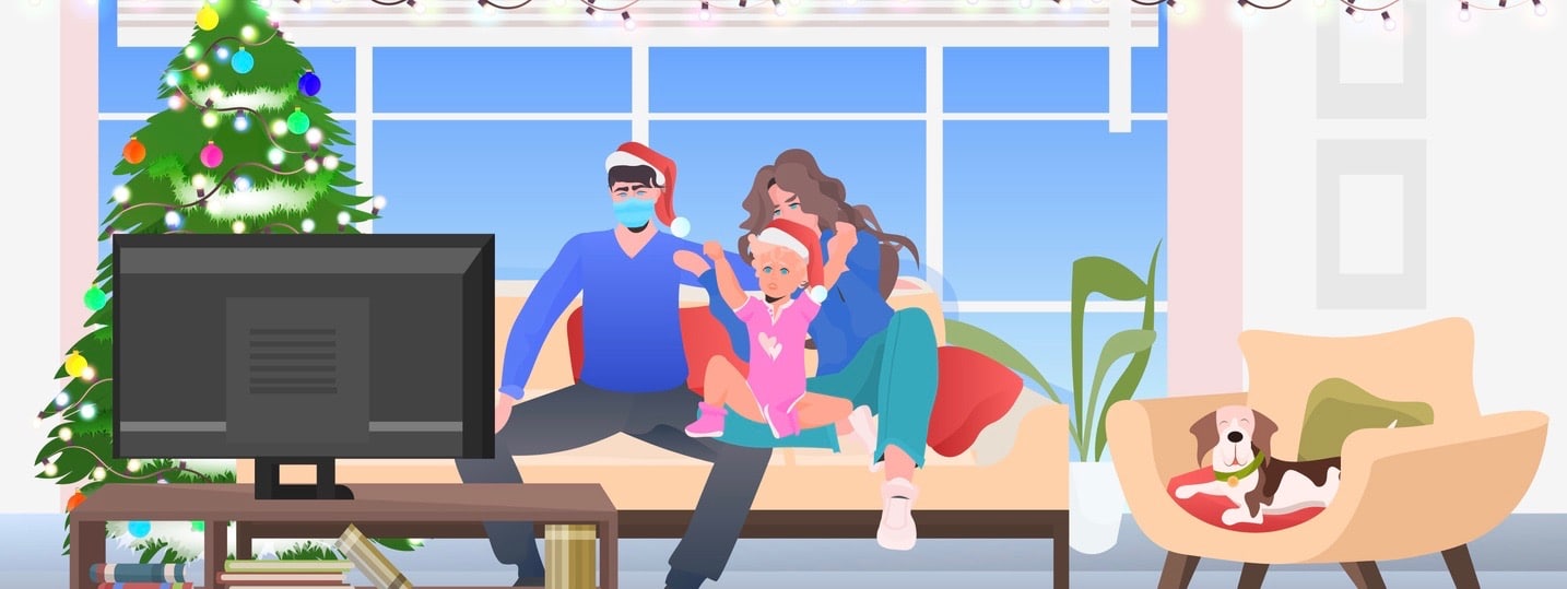 happy family spending time together parents with daughter in santa hats watching tv at home