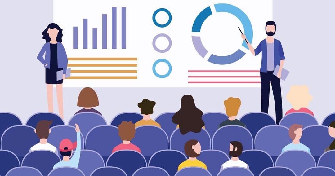 Business presentation with charts on the board in front of the audience at the conference.