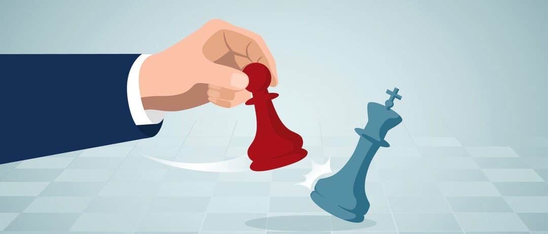 businessman making a chess move with a pawn to kick a queen in chess game