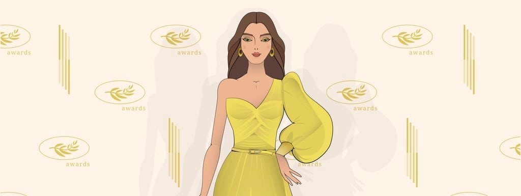 Woman model in a yellow evening dress on the red carpet.