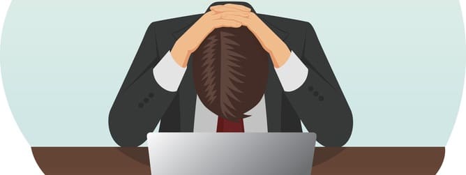 Failed and stressed businessman is tired to work on the computer. He put hands on the head.