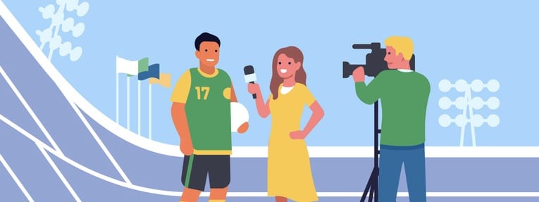 Female journalist with video cameraman interviewing soccer player athlete.