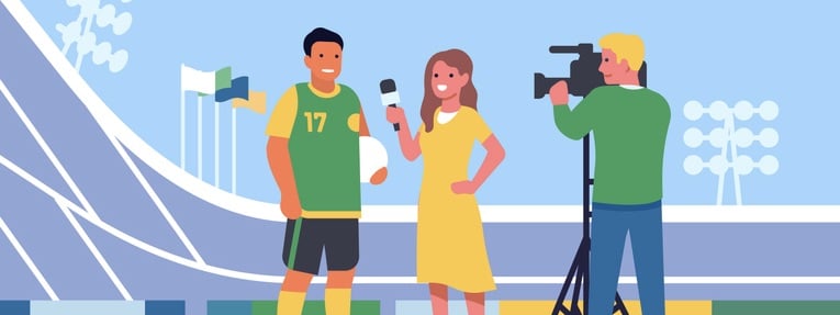 Female journalist with video cameraman interviewing soccer player athlete.