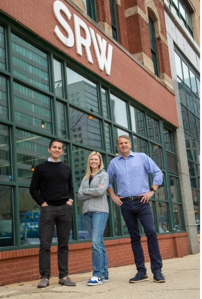 C.A. Fortune CEO, Tyler Lowell, stands alongside SRW co-founders Kate Weidner and Charlie Stone in Chicago's West Loop.