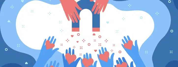 Concept Of Media Influence. Red Hand With Magnet Attracts Hearts. Engaging Followers Red Hand With Magnet Attracts Hearts. Engaging Followers