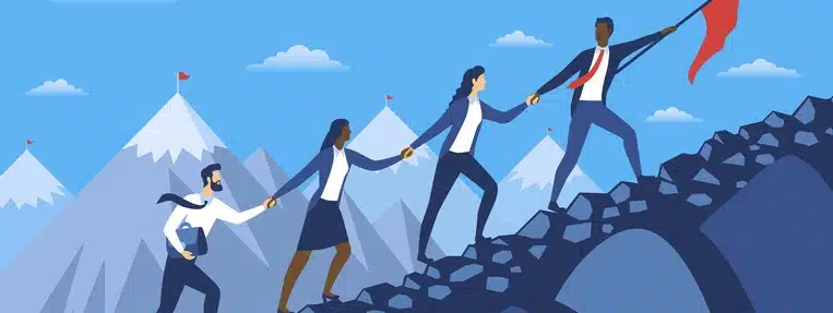 Abstract concept way to achieve business success Diverse multiracial team of specialists climbing mountain holding hands.